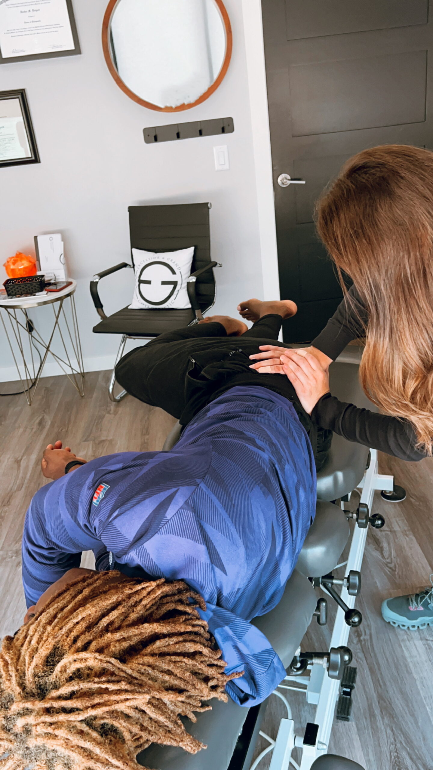 Dr. Heather Flatgard performing Active Release Technique on an athlete
