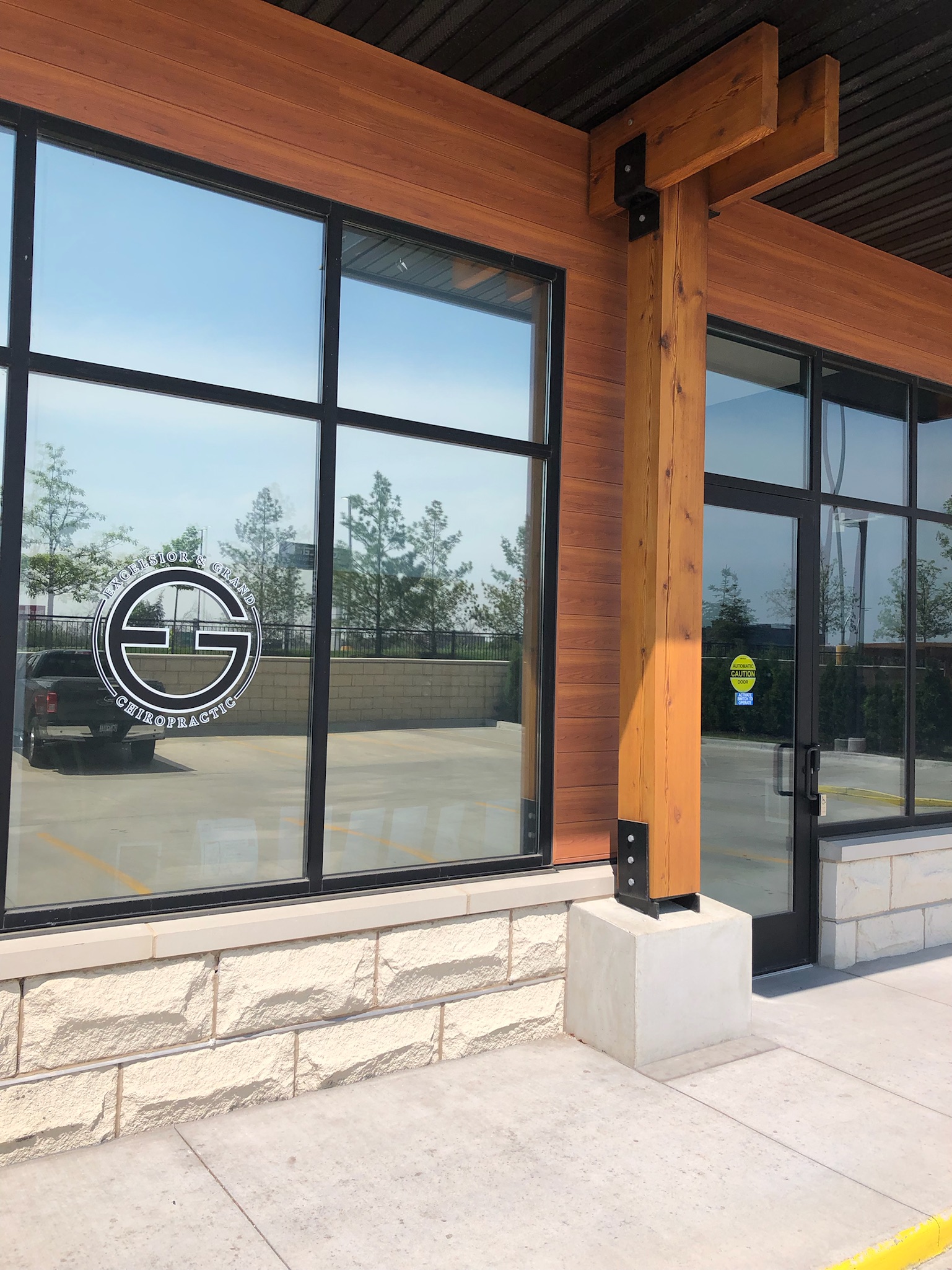Main entrance to Excelsior & Grand Chiropractic from the back parking lot in St. Louis Park, MN