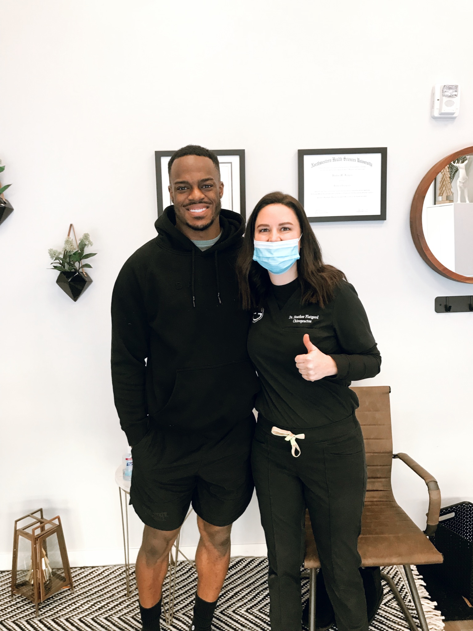 Dr. Heather with a patient at Excelsior & Grand Chiropractic in St. Louis Park, MN